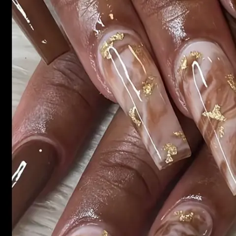 Long brown marble acrylic nails with gold flakes